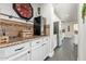 Granite-topped kitchen island with wine storage and beverage cooler at 5720 W Robb Ln, Glendale, AZ 85310