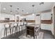 Bright kitchen with white cabinets and a kitchen island at 5720 W Robb Ln, Glendale, AZ 85310