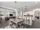 Modern kitchen with white cabinets and a large island at 5720 W Robb Ln, Glendale, AZ 85310