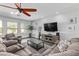 Spacious living room with sectional sofa and large windows at 5720 W Robb Ln, Glendale, AZ 85310