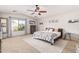 Large main bedroom with a king-size bed and plenty of natural light at 5720 W Robb Ln, Glendale, AZ 85310