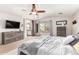 Main bedroom with a king bed, large windows and ensuite bathroom at 5720 W Robb Ln, Glendale, AZ 85310