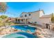 Inviting backyard oasis with a sparkling pool and patio area at 5720 W Robb Ln, Glendale, AZ 85310