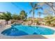 Inviting kidney-shaped pool with surrounding patio and landscaping at 5720 W Robb Ln, Glendale, AZ 85310