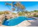 Stunning kidney shaped pool with a waterfall feature at 5720 W Robb Ln, Glendale, AZ 85310