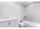 Bathroom with white vanity, tub and grey tile at 603 S 7Th St, Avondale, AZ 85323