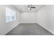 Bright bedroom with ceiling fan and grey carpet at 603 S 7Th St, Avondale, AZ 85323