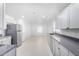 Modern kitchen with gray cabinets and stainless steel appliances at 603 S 7Th St, Avondale, AZ 85323