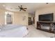 Spacious Primary bedroom with fireplace, TV, and patio access at 6168 S Fairway Pl, Gold Canyon, AZ 85118