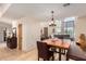 Bright dining area with wood table and seating, adjacent to kitchen at 6168 S Fairway Pl, Gold Canyon, AZ 85118