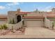 Tan stucco exterior boasts a two-car garage and desert landscaping at 6168 S Fairway Pl, Gold Canyon, AZ 85118