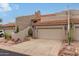 Two-car garage and inviting entryway of this beautiful home at 6168 S Fairway Pl, Gold Canyon, AZ 85118