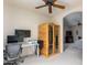 Home office with built-in sauna, desk, and large TV at 6168 S Fairway Pl, Gold Canyon, AZ 85118