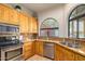 Kitchen features granite counters, wood cabinets, and sink at 6168 S Fairway Pl, Gold Canyon, AZ 85118