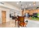 Kitchen island with seating and view into dining area at 6168 S Fairway Pl, Gold Canyon, AZ 85118