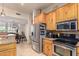 Kitchen with stainless steel appliances and wood cabinets at 6168 S Fairway Pl, Gold Canyon, AZ 85118