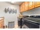 Laundry room with washer, dryer, and built-in cabinets at 6168 S Fairway Pl, Gold Canyon, AZ 85118