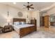 Bright main bedroom with wooden furniture and a ceiling fan at 6168 S Fairway Pl, Gold Canyon, AZ 85118