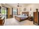 Spacious main bedroom with a king-size bed and access to a patio at 6168 S Fairway Pl, Gold Canyon, AZ 85118