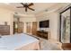 Main bedroom with large TV and sliding door leading outside at 6168 S Fairway Pl, Gold Canyon, AZ 85118