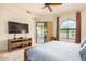 Main bedroom with access to backyard and pool views at 6168 S Fairway Pl, Gold Canyon, AZ 85118