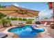 Refreshing kidney-shaped pool with a floating lounger at 6168 S Fairway Pl, Gold Canyon, AZ 85118