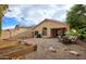 Large backyard with patio, garden, and play area at 6458 E Raftriver St, Mesa, AZ 85215