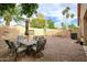 Backyard with patio furniture and play area at 6458 E Raftriver St, Mesa, AZ 85215