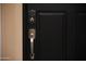 Black front door with keyless entry and silver handle at 6458 E Raftriver St, Mesa, AZ 85215