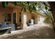 Relaxing backyard patio with built-in grill and seating area at 6458 E Raftriver St, Mesa, AZ 85215