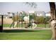 Modern playground with slides and climbing structures at 6458 E Raftriver St, Mesa, AZ 85215