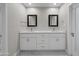 Double vanity bathroom with white cabinets and quartz countertops at 6630 E Dreyfus Ave, Scottsdale, AZ 85254