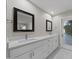 Bathroom with double vanity, white cabinets, and quartz countertops at 6630 E Dreyfus Ave, Scottsdale, AZ 85254