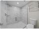 Spa-like bathroom with a large walk-in shower and marble tile at 6630 E Dreyfus Ave, Scottsdale, AZ 85254