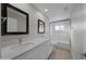 Modern bathroom with double vanity, quartz countertop and a bathtub at 6630 E Dreyfus Ave, Scottsdale, AZ 85254