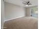 Bright bedroom with carpet flooring and sliding glass door to backyard at 6630 E Dreyfus Ave, Scottsdale, AZ 85254