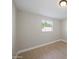 Simple bedroom with wood-look flooring and a window offering natural light at 6630 E Dreyfus Ave, Scottsdale, AZ 85254