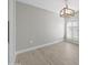 Bright dining room features wood-look tile floors and an arched window with plantation shutters at 6630 E Dreyfus Ave, Scottsdale, AZ 85254