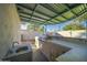 Outdoor kitchen with built-in grill and sink under covered patio at 6630 E Dreyfus Ave, Scottsdale, AZ 85254