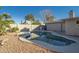 Inviting kidney-shaped pool with a large patio area at 6630 E Dreyfus Ave, Scottsdale, AZ 85254