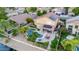 Drone view of a house featuring a solar-paneled roof, pool, and canal access at 6811 W Monona Dr, Glendale, AZ 85308