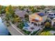 Aerial view of house with pool, spa, and solar panels; located on canal at 6811 W Monona Dr, Glendale, AZ 85308