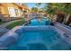 Relaxing hot tub with views of the pool and surrounding landscape at 6811 W Monona Dr, Glendale, AZ 85308