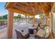 Covered patio with comfortable seating overlooking the pool at 6811 W Monona Dr, Glendale, AZ 85308