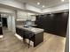 Modern kitchen with marble island and LED lighting at 7137 E Rancho Vista Dr # 4011, Scottsdale, AZ 85251