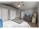 Bedroom with a metal bed frame, dresser and mirror at 7245 E Cambridge Ave, Scottsdale, AZ 85257