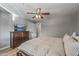 Bedroom with large bed, dresser, and ceiling fan at 7245 E Cambridge Ave, Scottsdale, AZ 85257