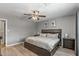 Primary bedroom with wood floors and ceiling fan at 7245 E Cambridge Ave, Scottsdale, AZ 85257