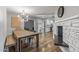 Open dining area with a rustic wood table and view into the kitchen at 7245 E Cambridge Ave, Scottsdale, AZ 85257