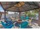 Cozy fire pit surrounded by chairs under a covered gazebo at 7245 E Cambridge Ave, Scottsdale, AZ 85257